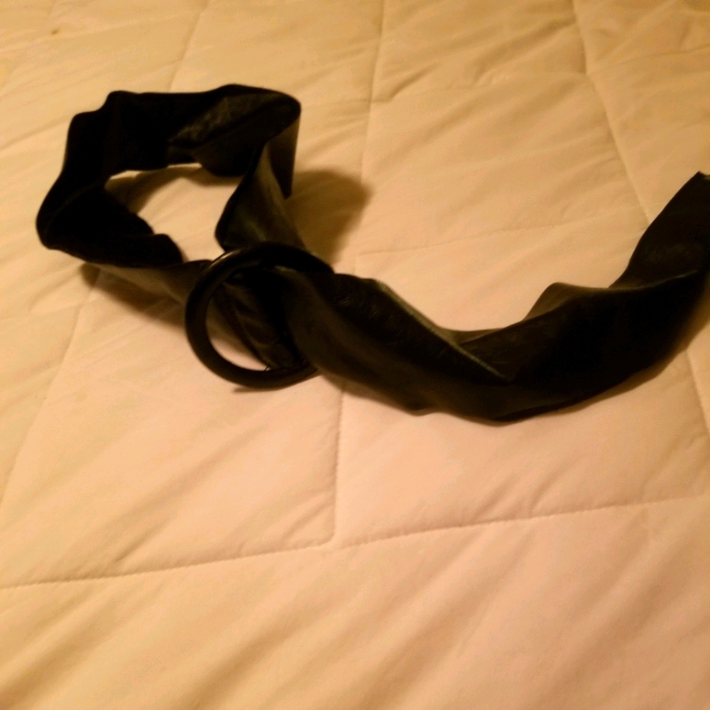Black faux leather wide width belt.